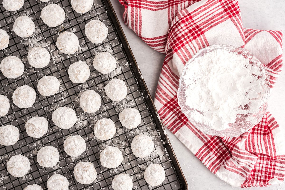 snowball cookies on wire rack