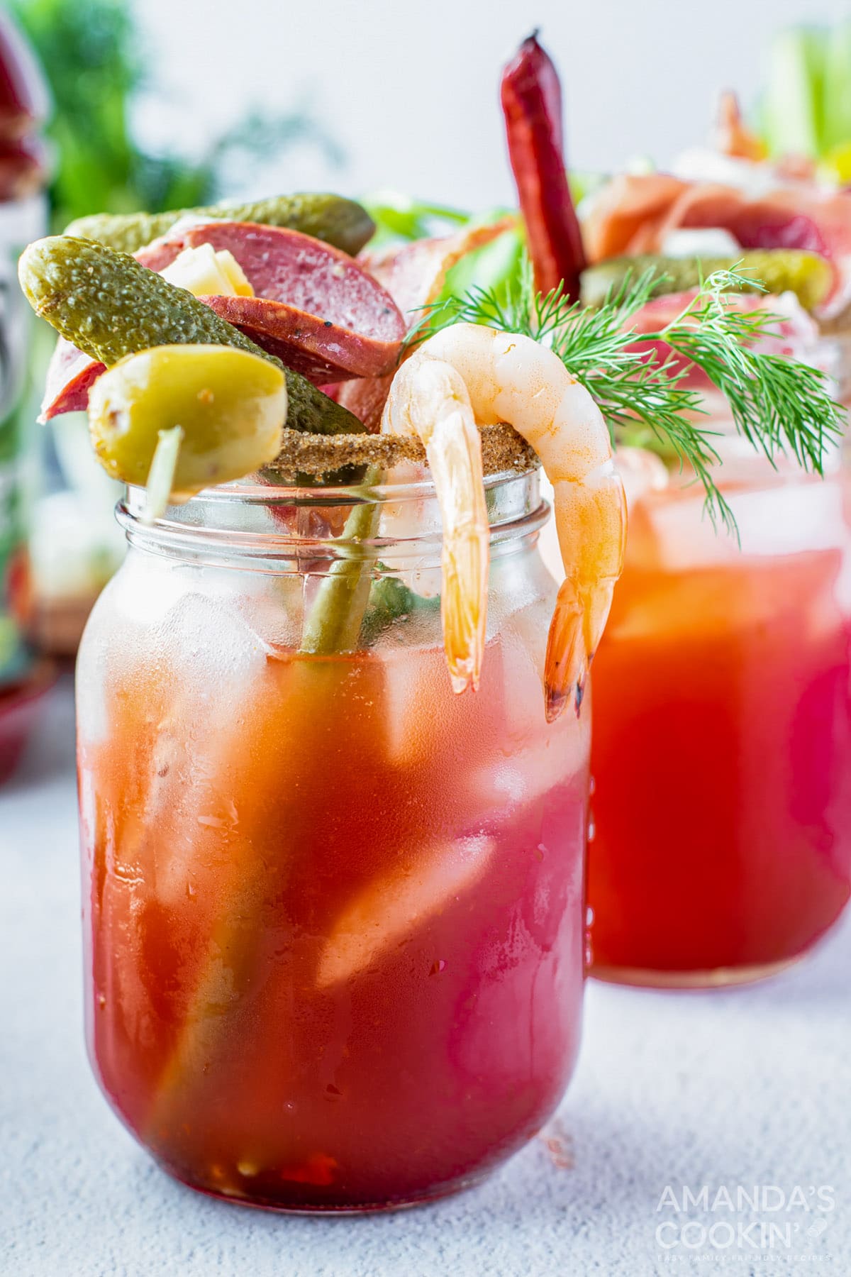 bloody mark drink with olive, pickle, sausage, cheese, and shrimp