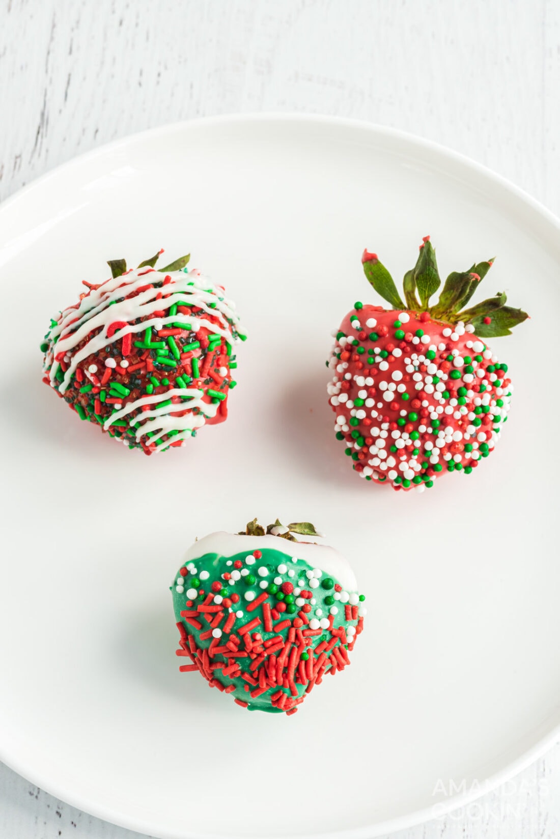 chocolate covered strawberries with christmas colored chocolate and sprinkles