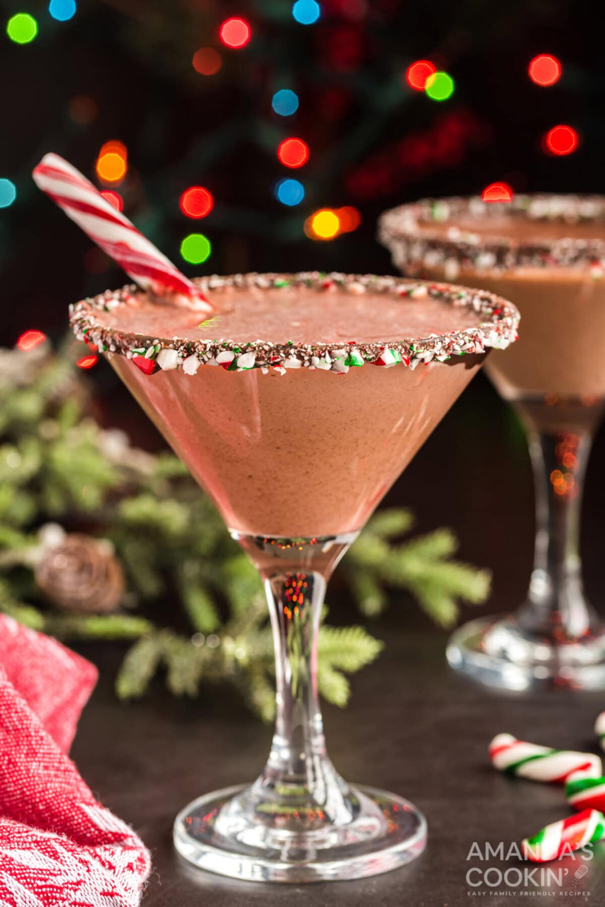 chocolate peppermint martini with a candy cane in it