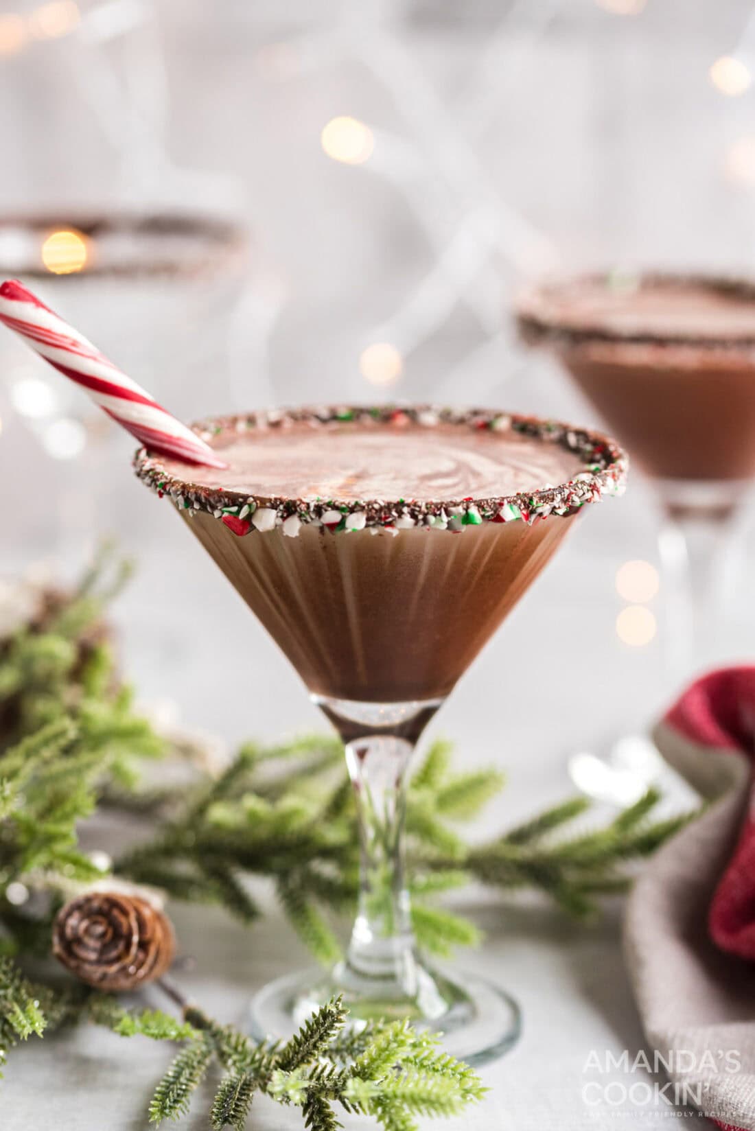 chocolate peppermint martini with a peppermint stick in it