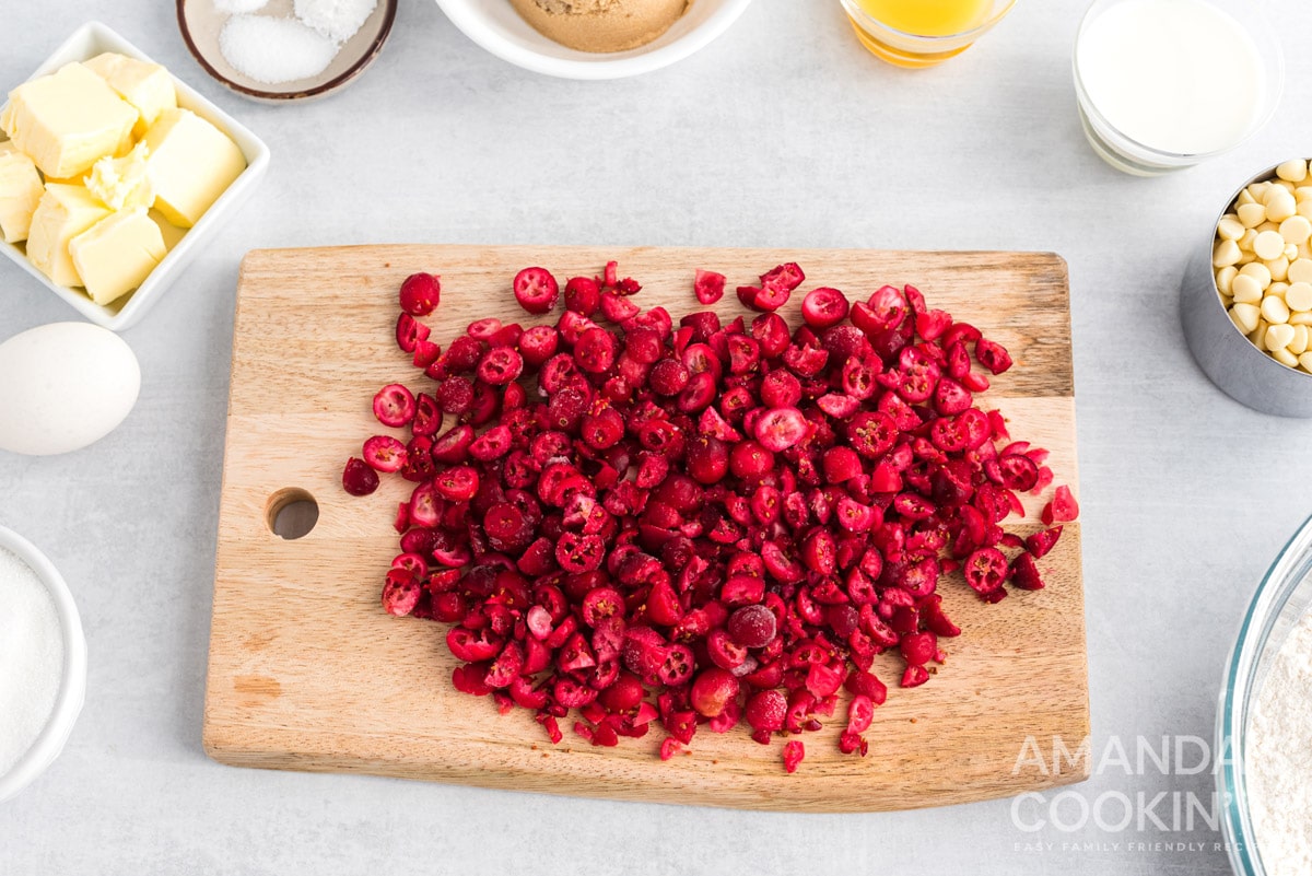 chopped frozen cranberries on cutting board