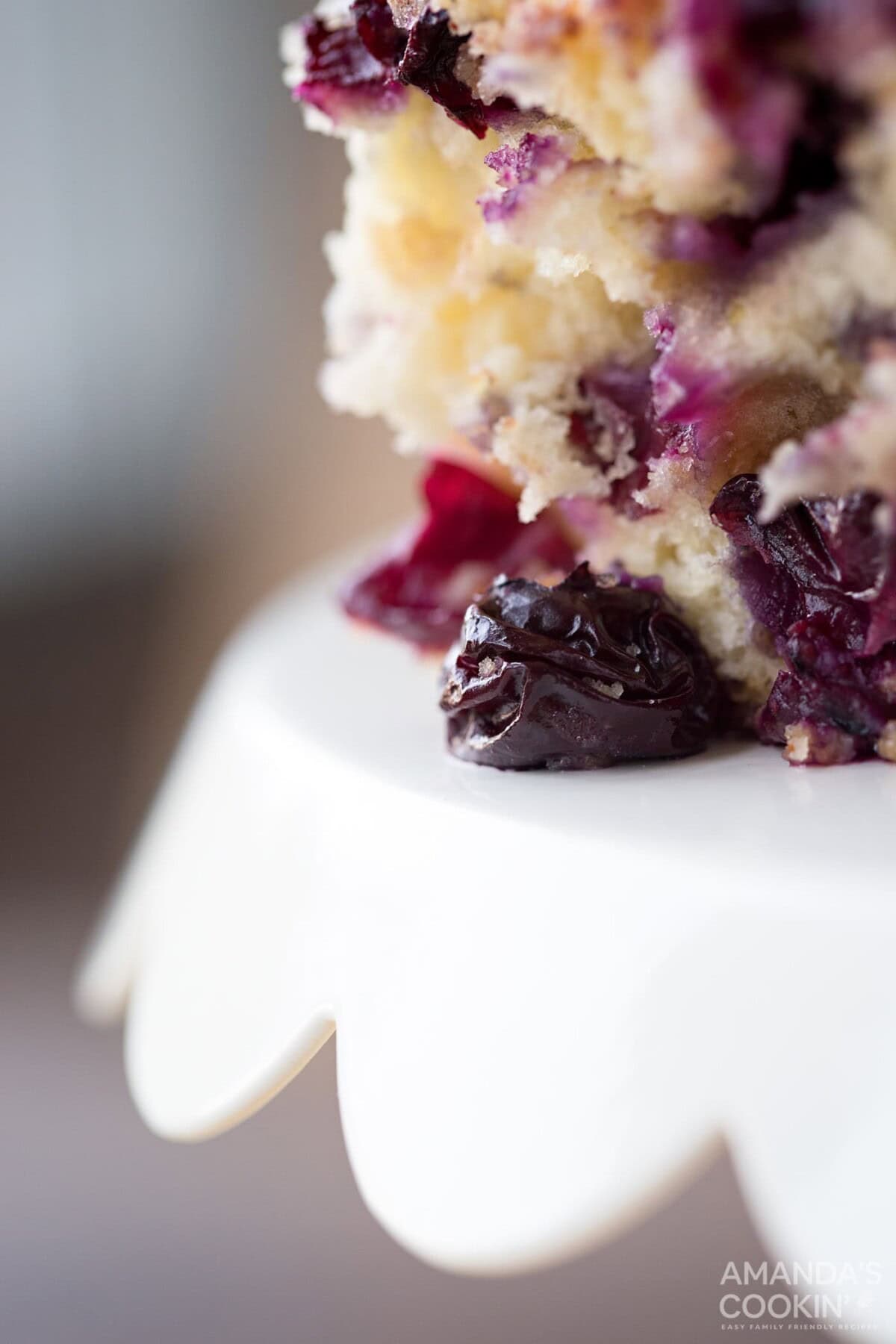 Blueberry breakfast cake, coffee cake, whatever you want to call it, it's overflowing with blueberries and absolutely delicious. #blueberrycake #blueberrycoffeecake #blueberrybuckle #blueberrydessert #blueberries #coffeecake #coffeecakerecipes #breakfastcake #recipesforblueberries extreme closeup of blueberry cake
