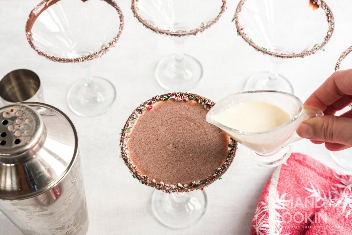 adding cream to cocktail