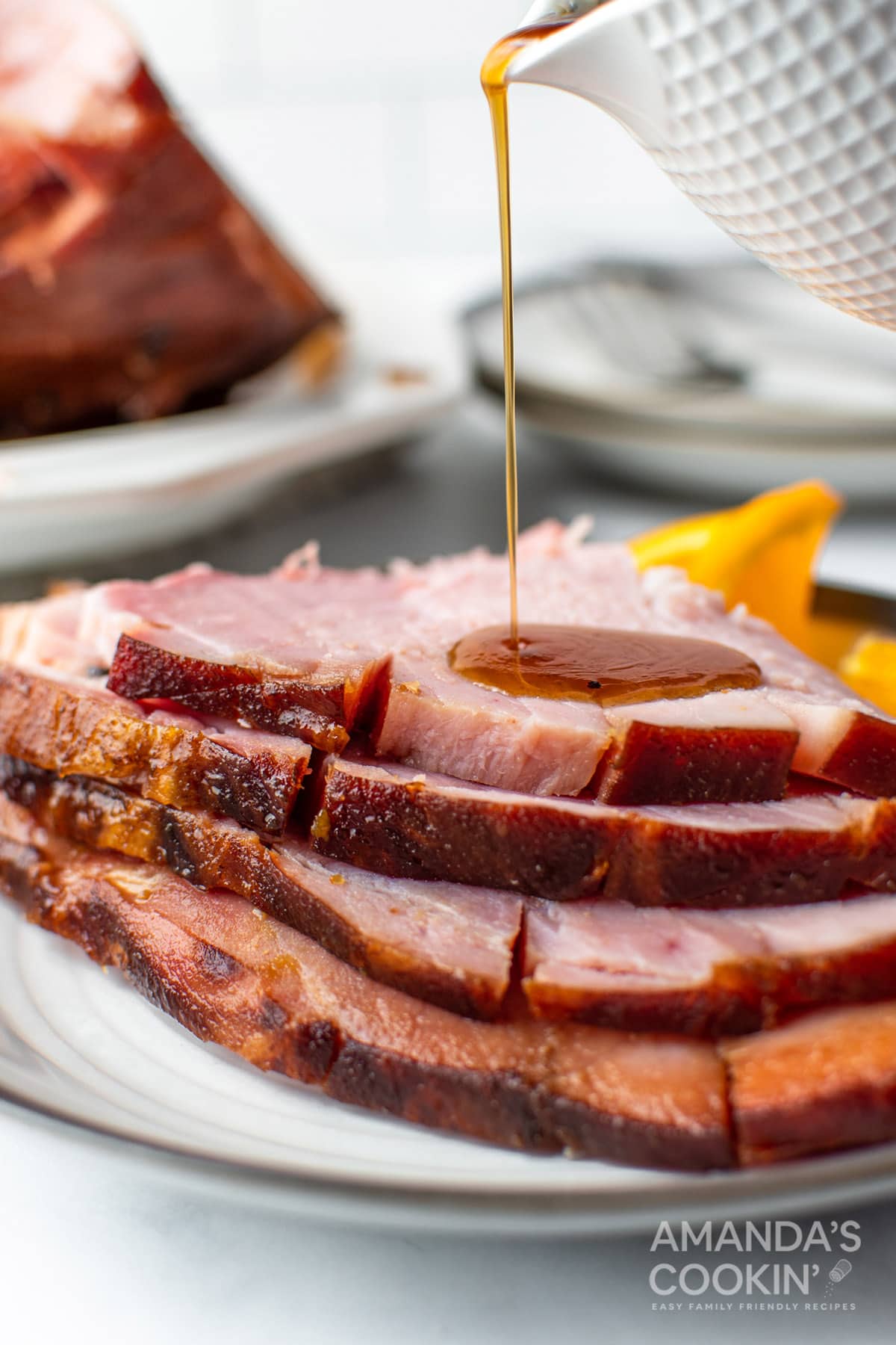 pouring glaze on ham slices