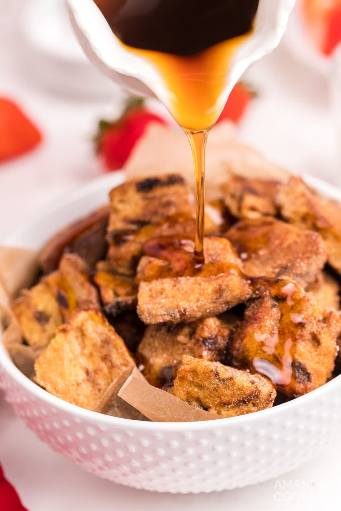 pouring syrup over Air Fryer French Toast Bites
