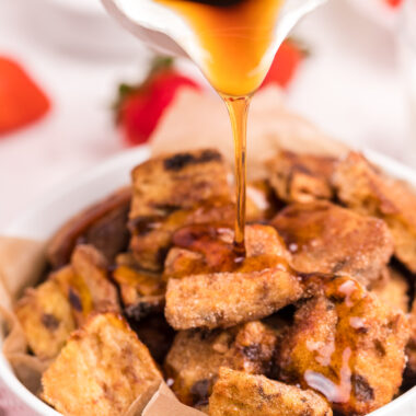 pouring syrup over Air Fryer French Toast Bites