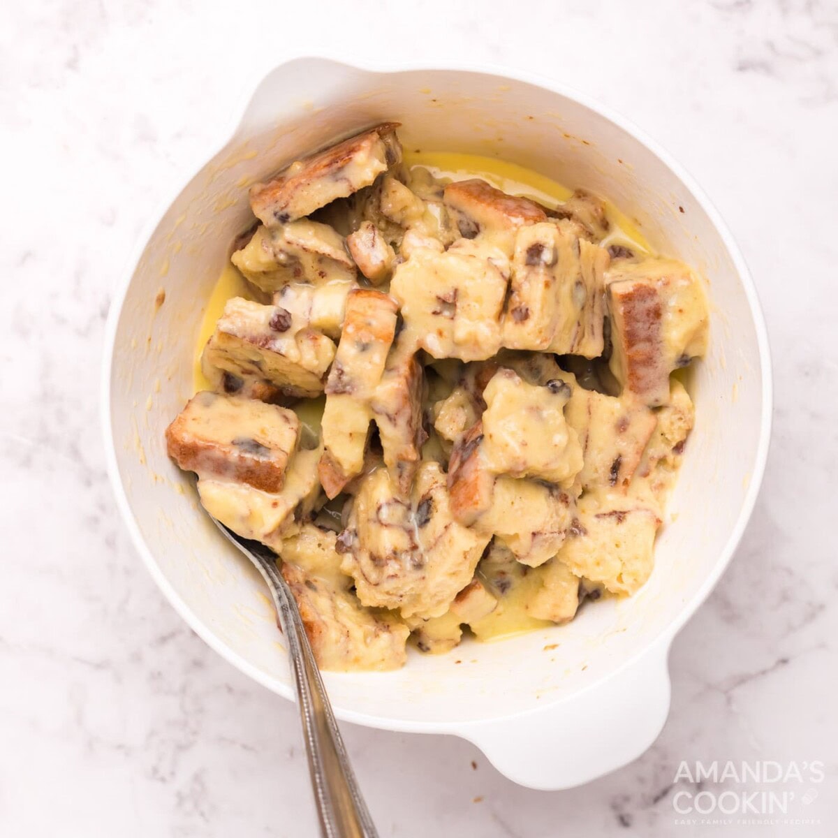 bread squares in a bowl of egg mixture