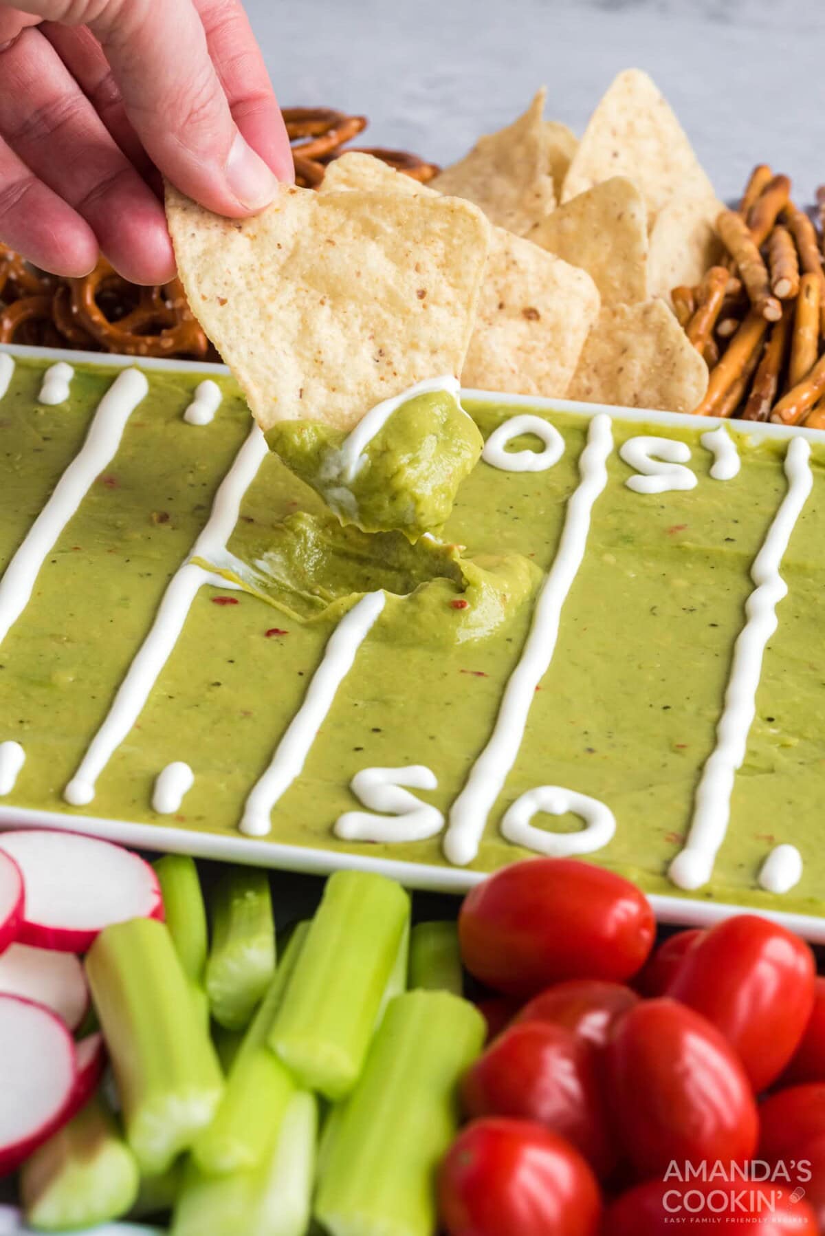 dipping a chip into guacamole