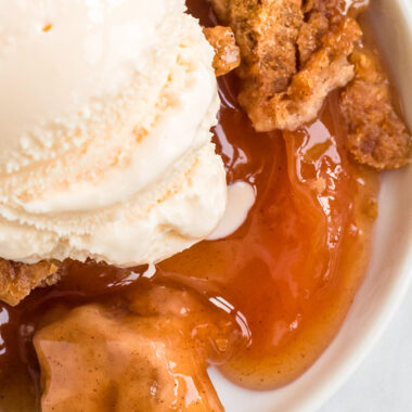 apple cobbler with ice cream on a plate