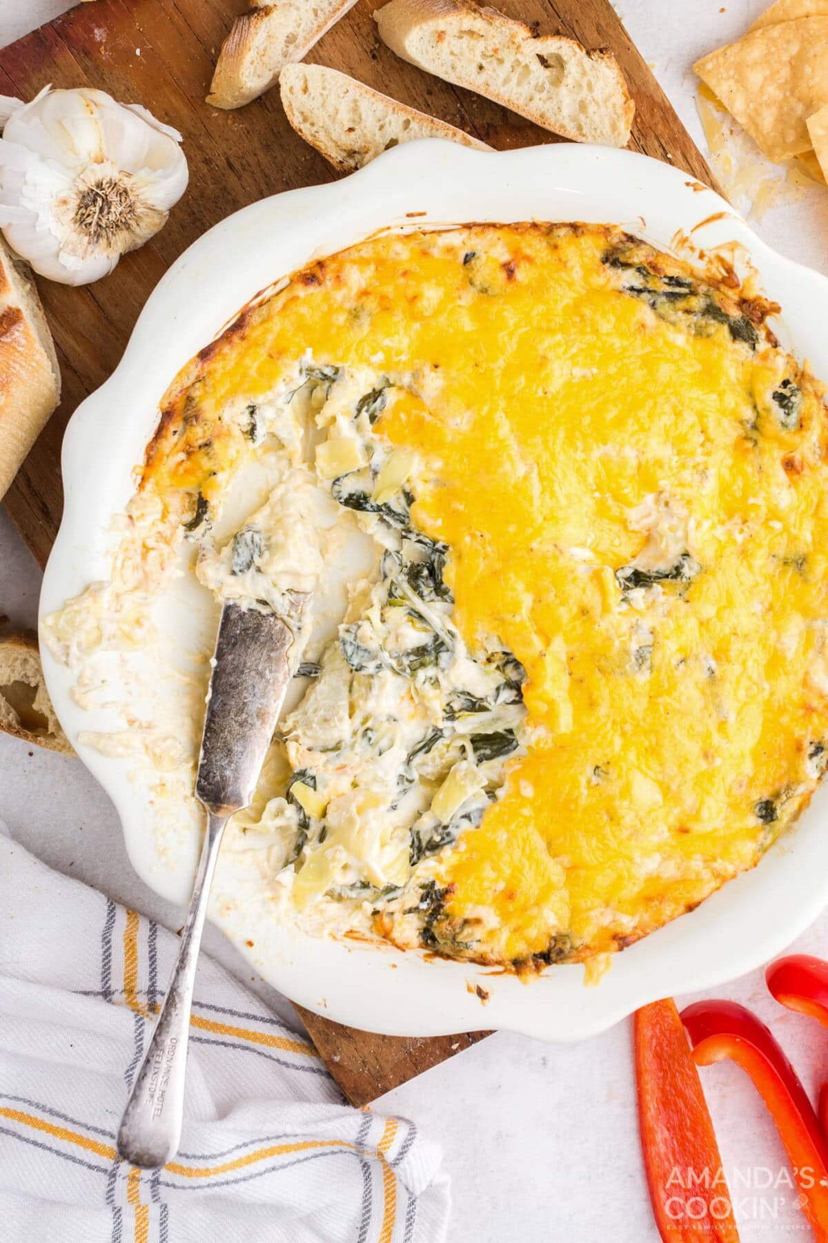 dish of hot spinach dip with some taken out