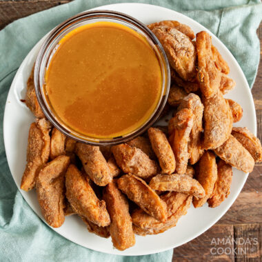 plate of air fryer apple fries with caramel sauce
