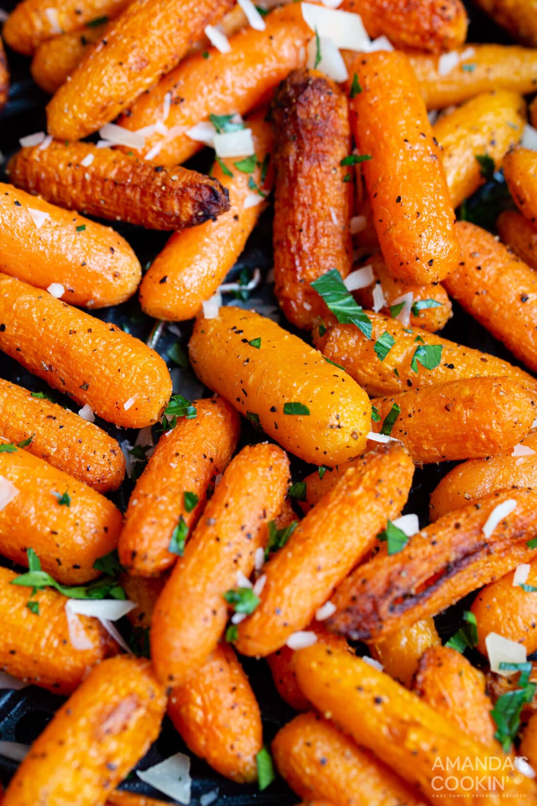 cooked carrots in an air fryer basket