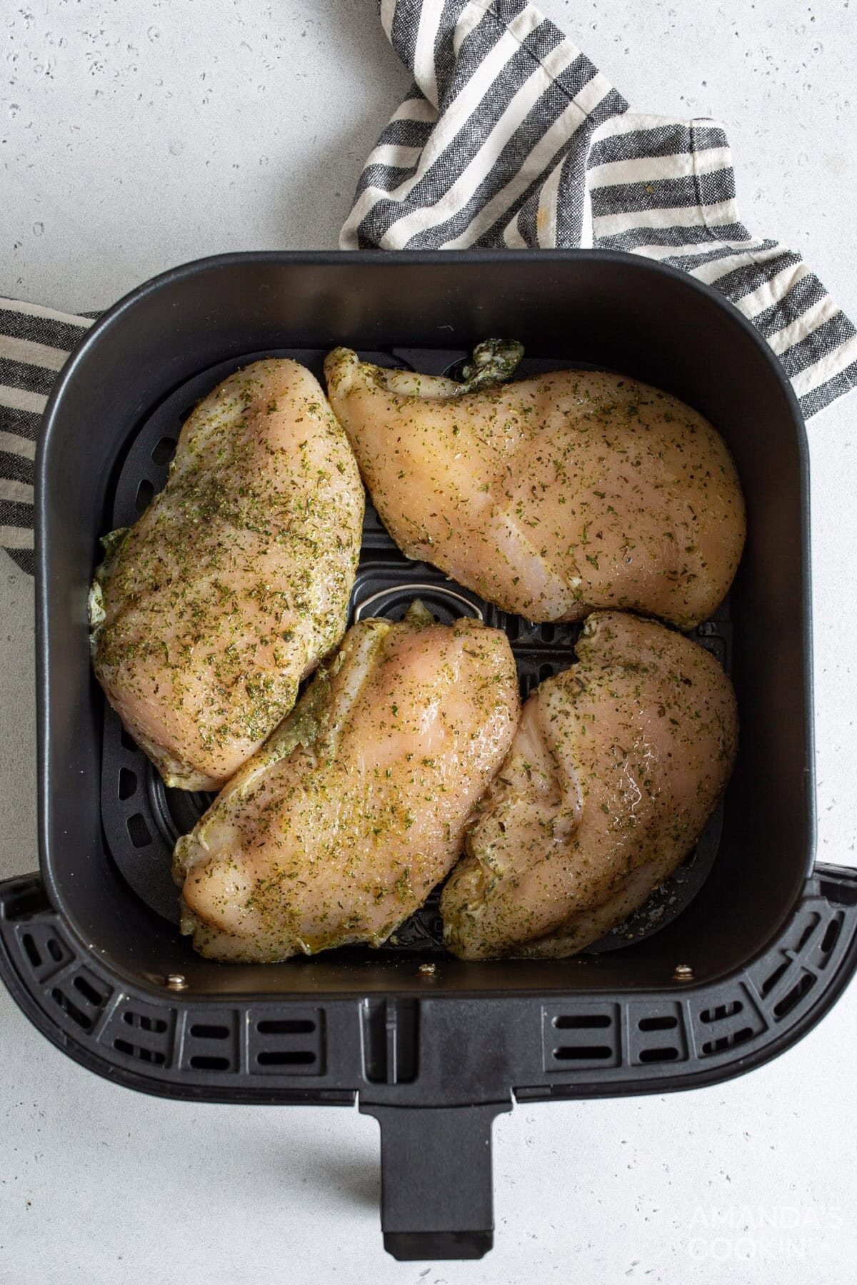 raw chicken in air fryer basket