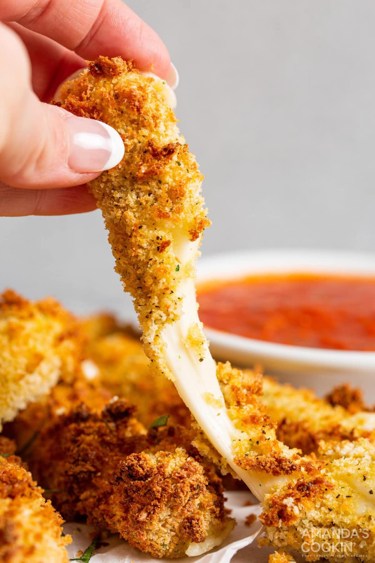 lifting a melty mozzarella stick