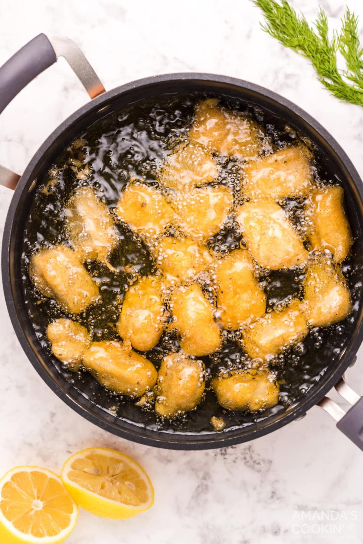 battered fish frying in oil