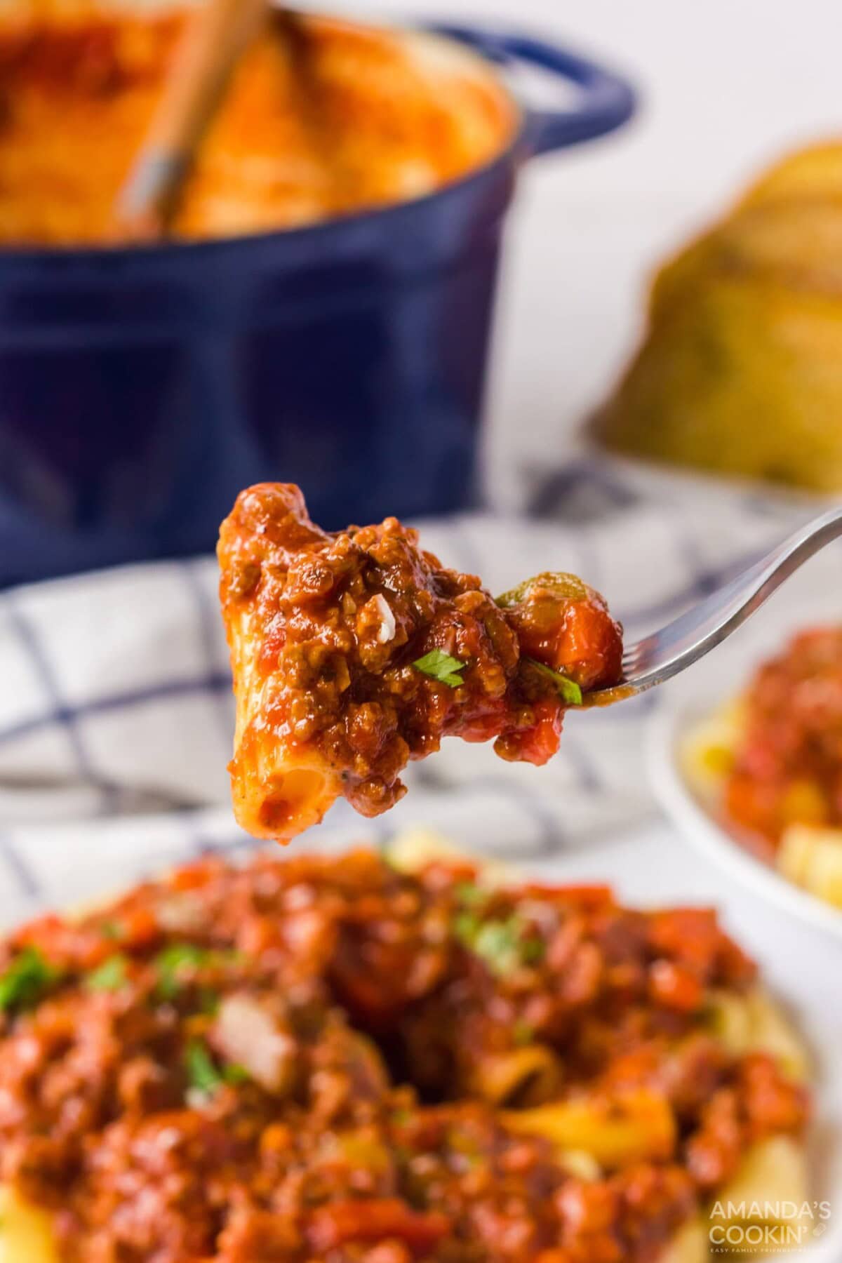 fork full of bolognese pasta