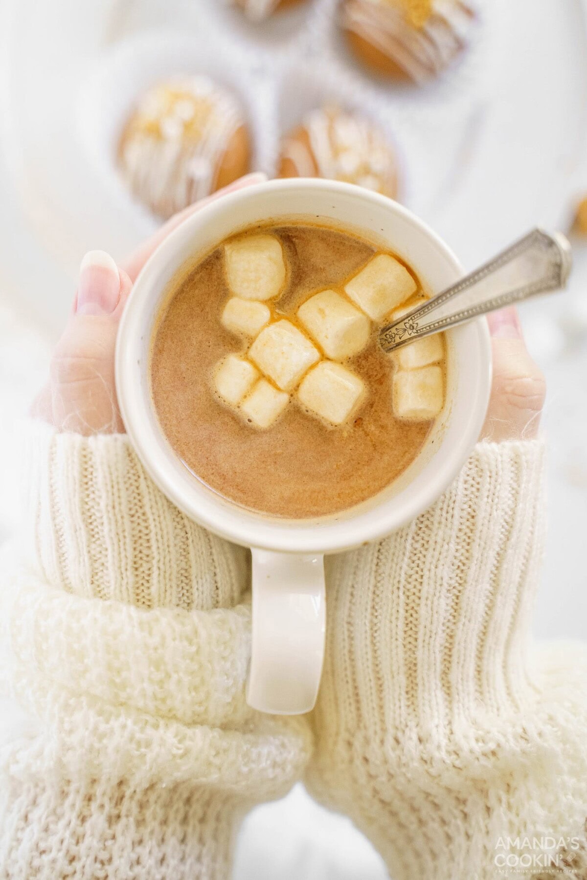 woman holding mug of hot cocoa