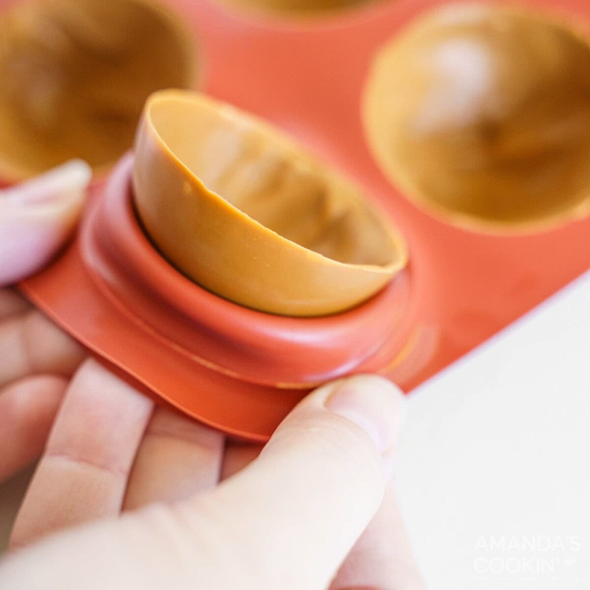 removing half a cocoa bomb out of mold
