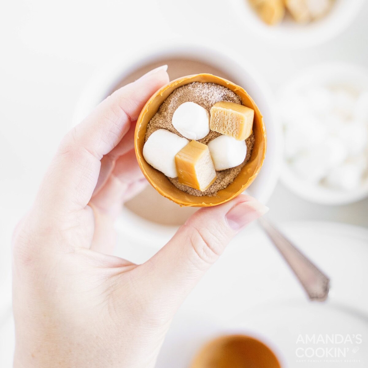 cocoa and marshmallows added to cocoa bomb mold