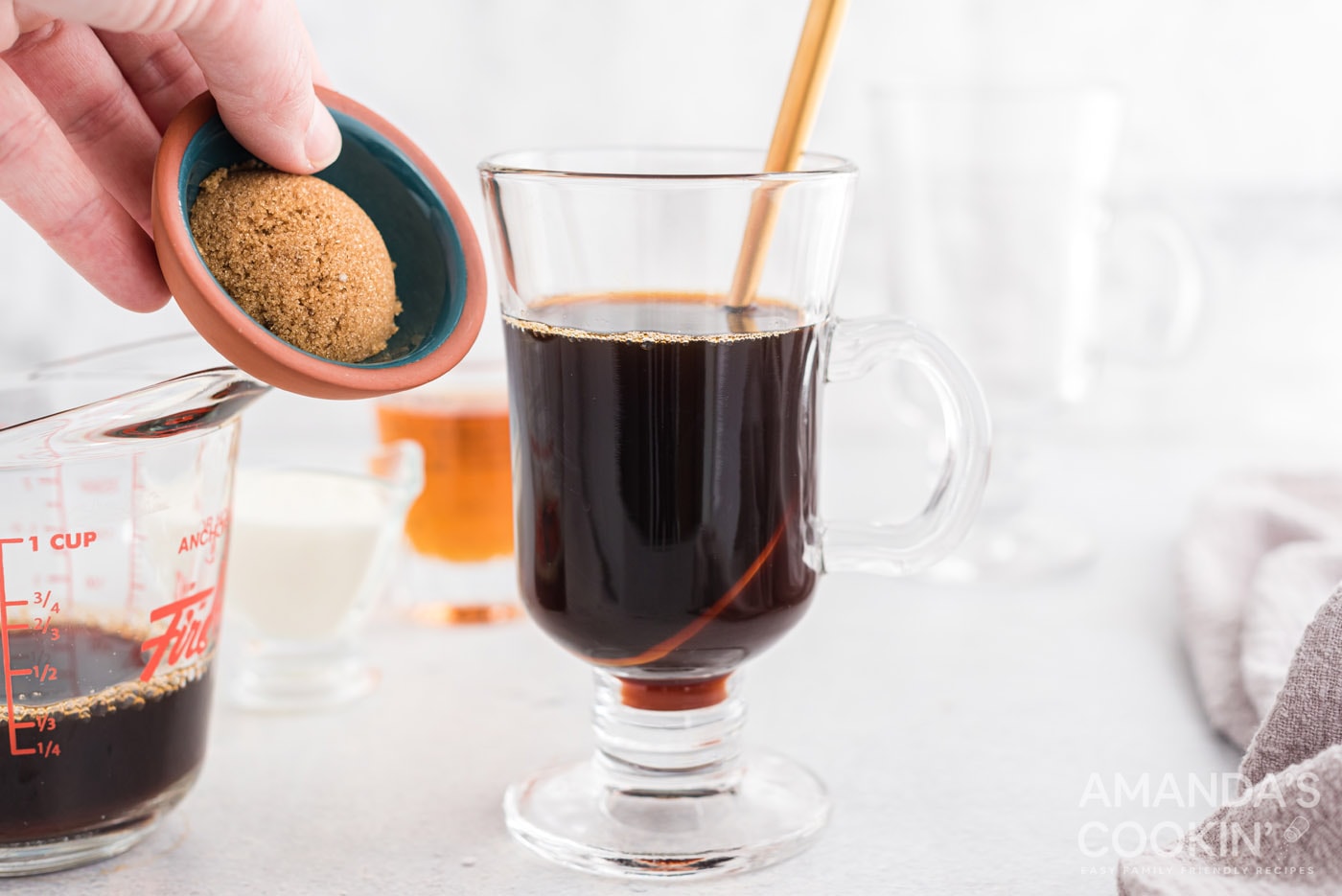 adding brown sugar to coffee