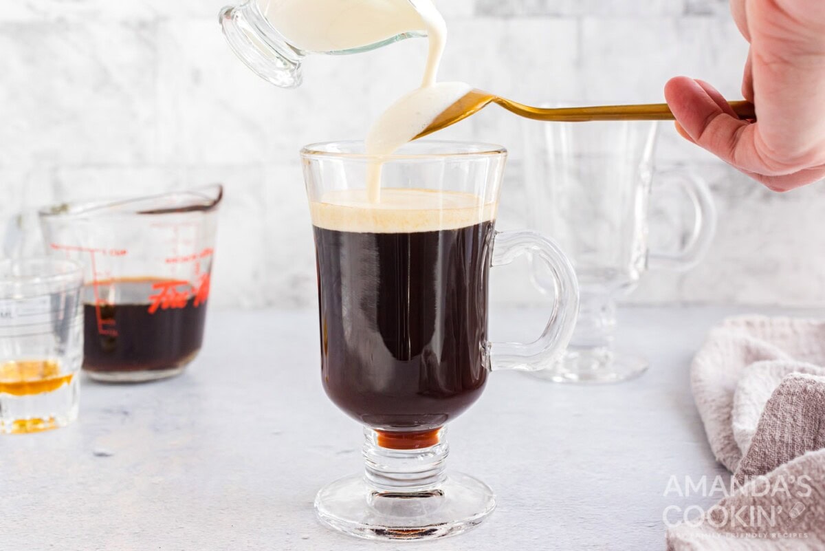 pouring thickened cream over the back of a spoon