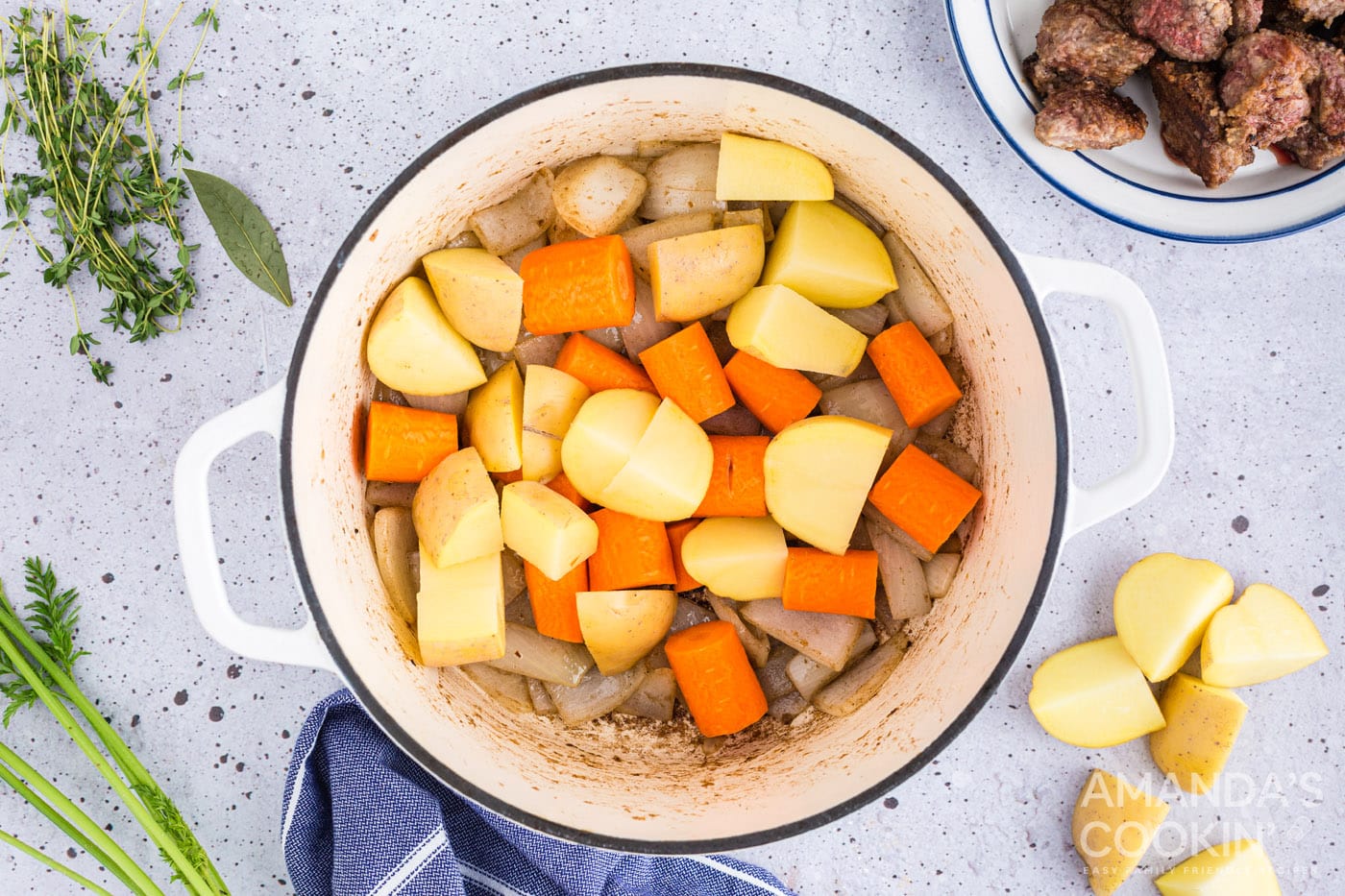 add potatoes and carrots to the pot