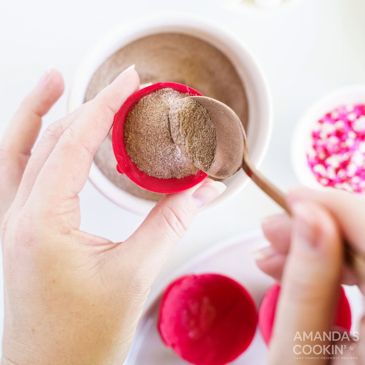 adding hot cocoa to cocoa bomb mold