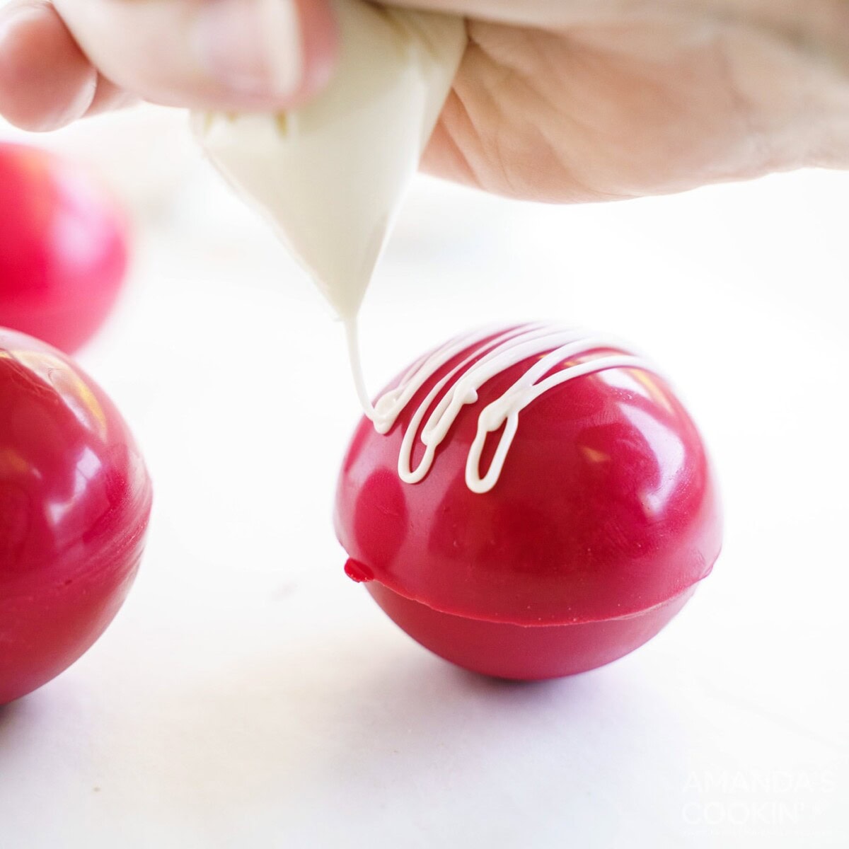 decorating a red velvet hot cocoa bomb