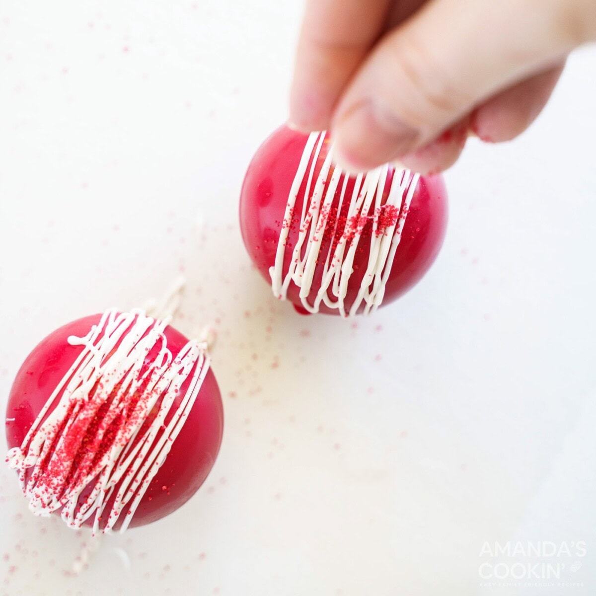 adding sprinkles to cocoa bombs