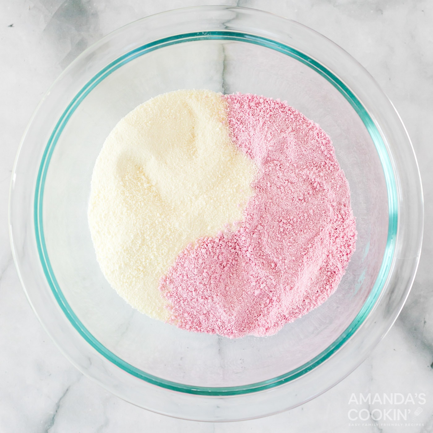 strawberry drink mix and powdered milk in bowl
