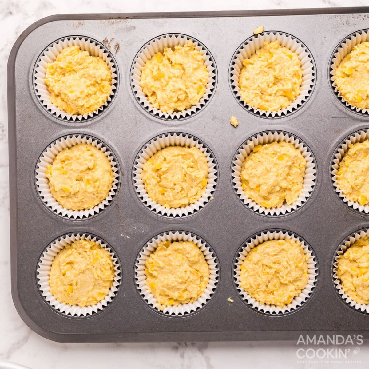 cornbread muffin batter in a pan