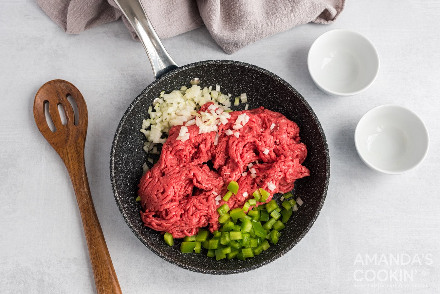 green pepper, onion and ground beef in skillet