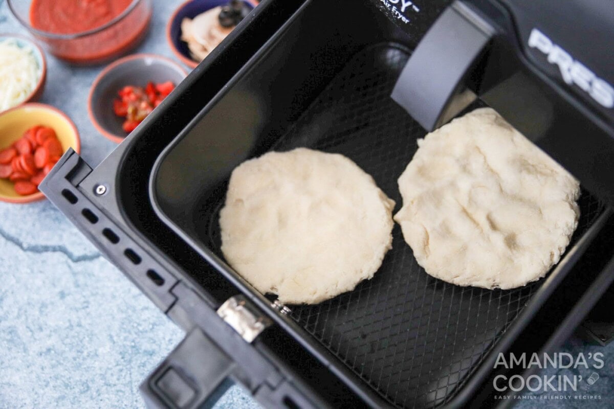 pizza dough circles in air fryer basket