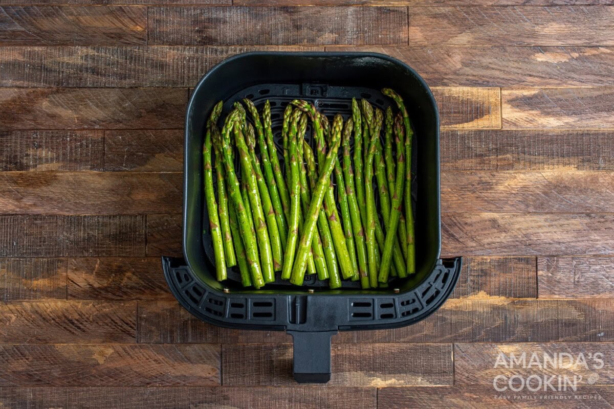 asparagus in an air fryer basket