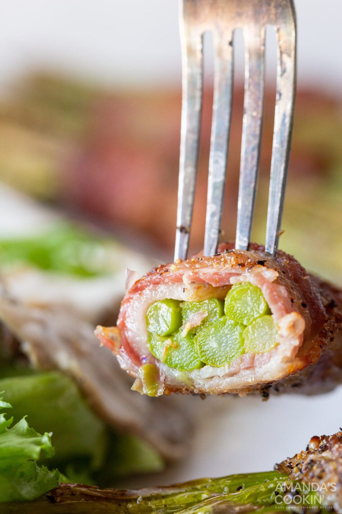 fork full of cut Bacon Wrapped Asparagus