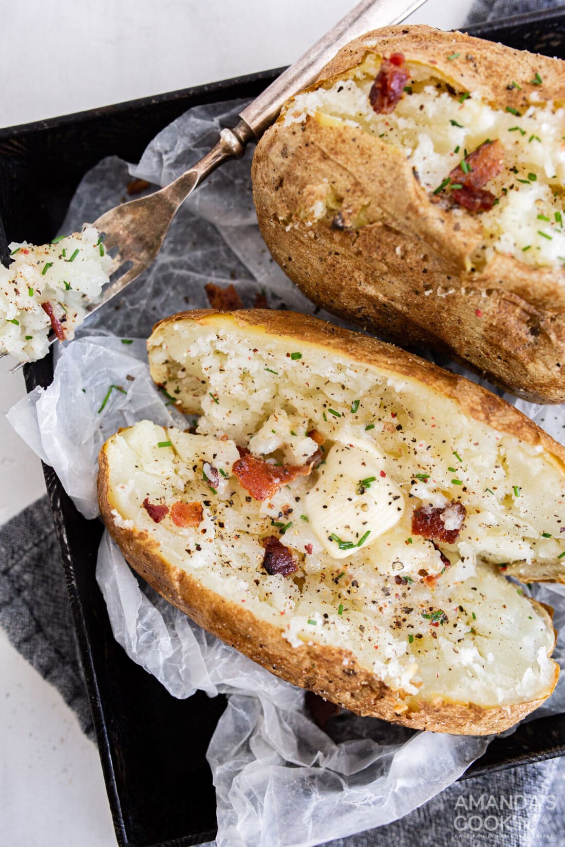 baked potato with butter and bacon