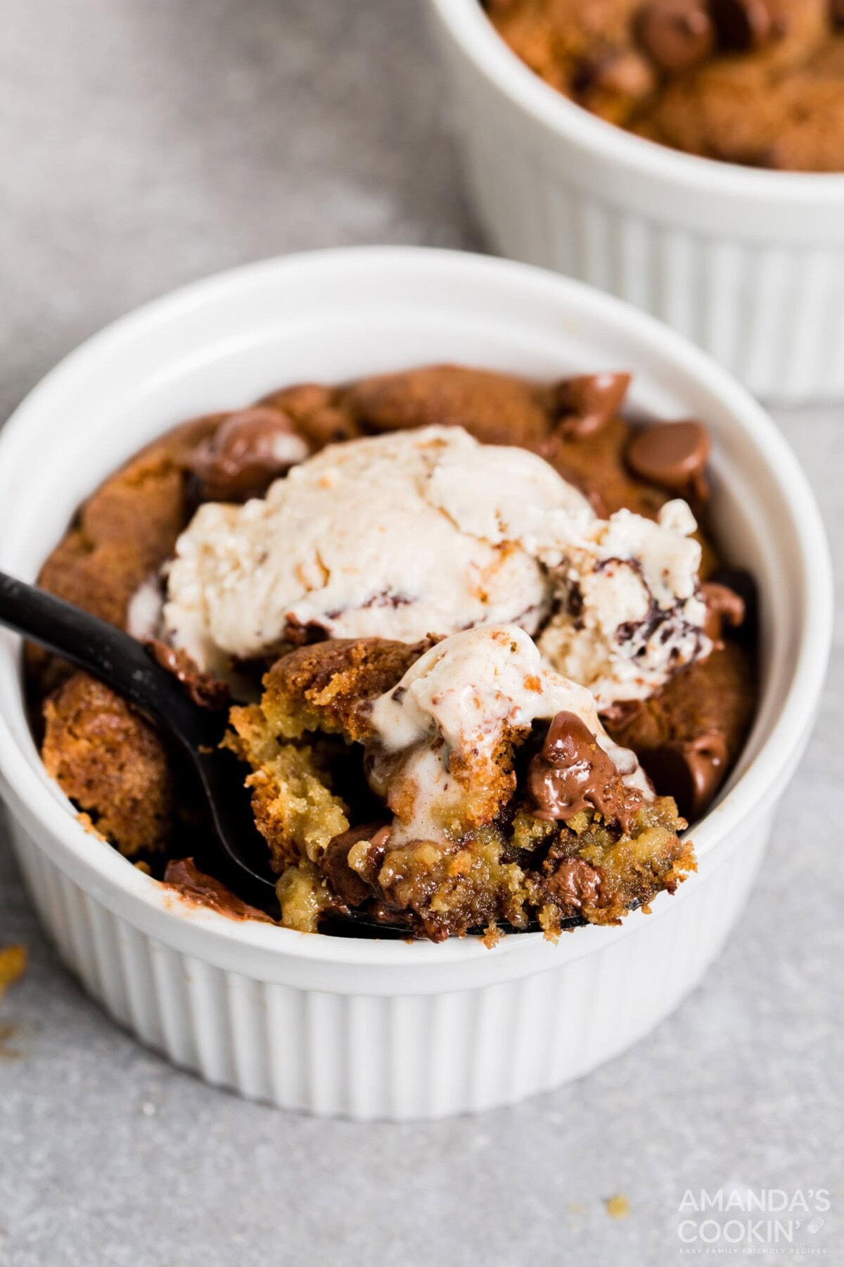 air fryer chocolate chip cookies in a ramekin with ice cream