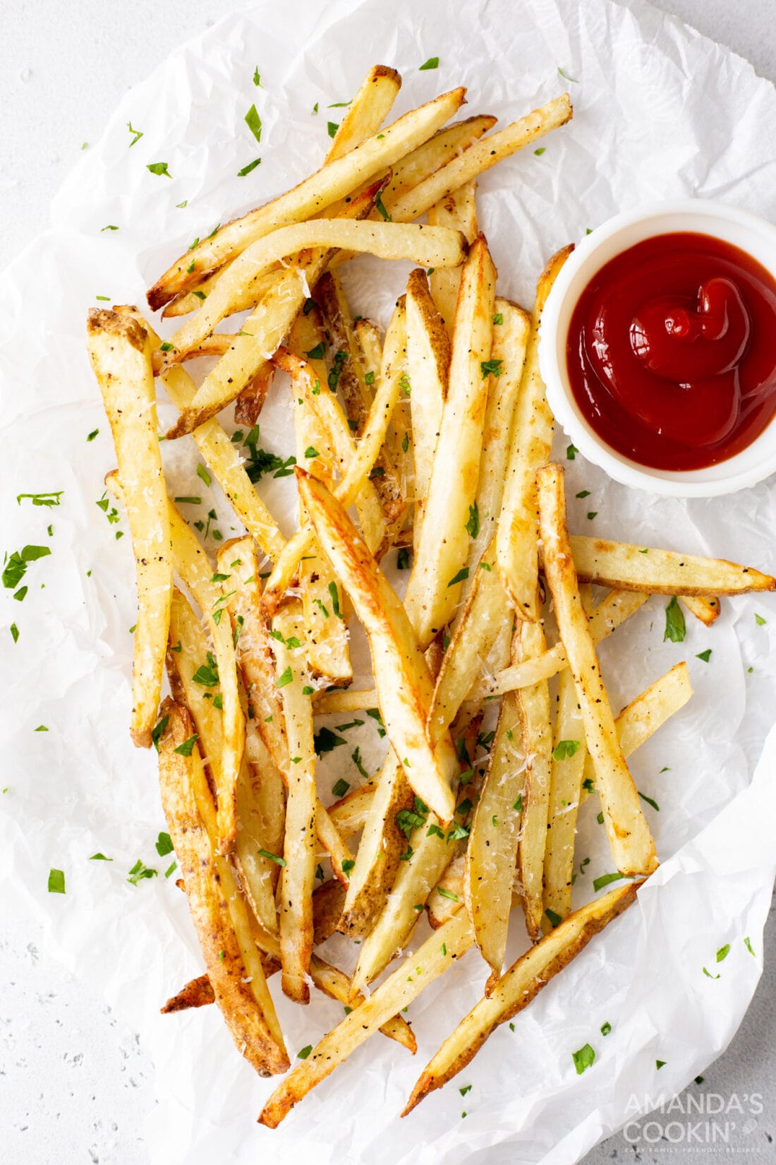 air fryer french fries on a plate with ketchup
