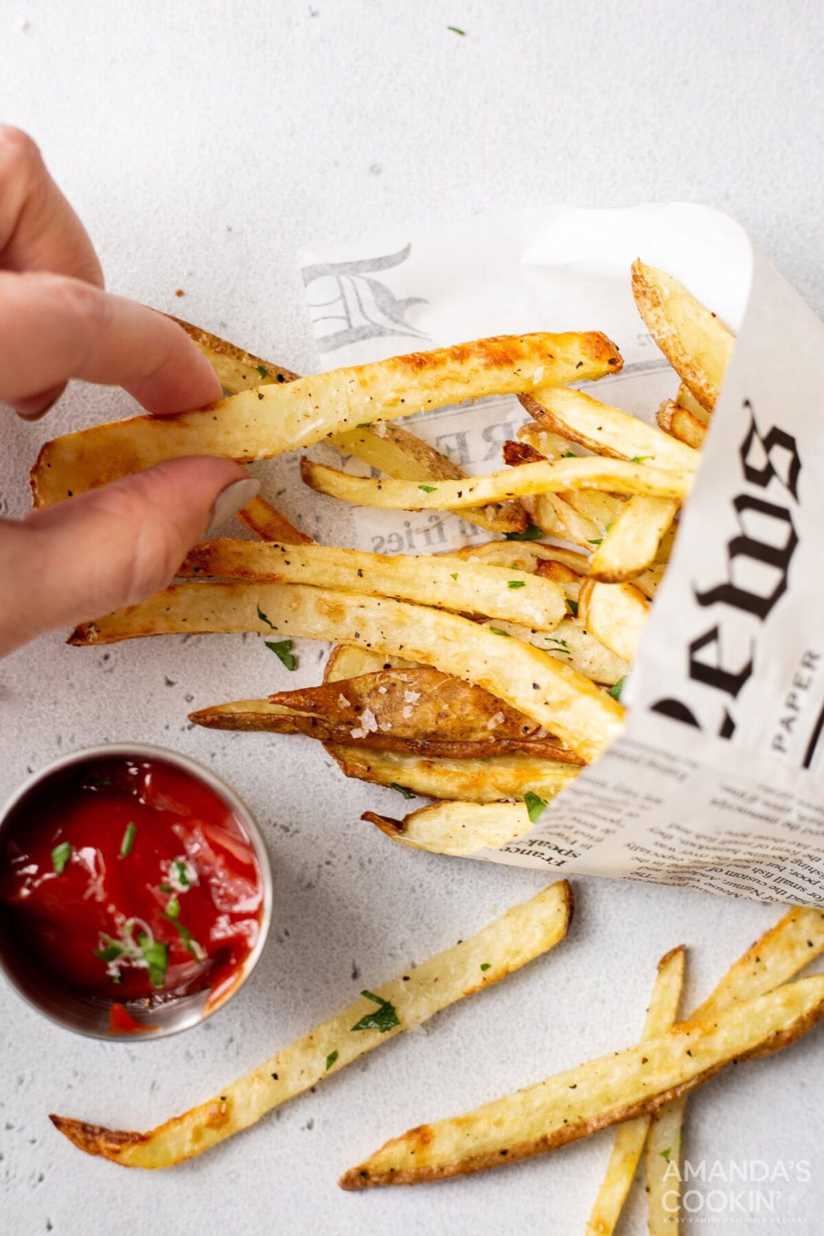 hand taking an air fryer french fry