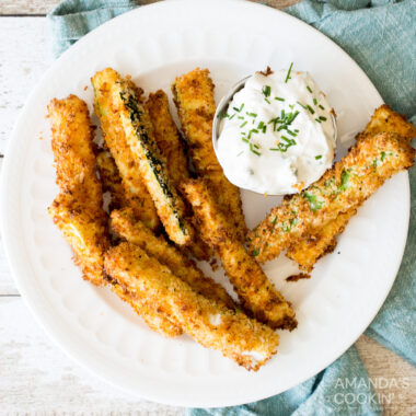 air fryer zucchini fries with sauce on a plate
