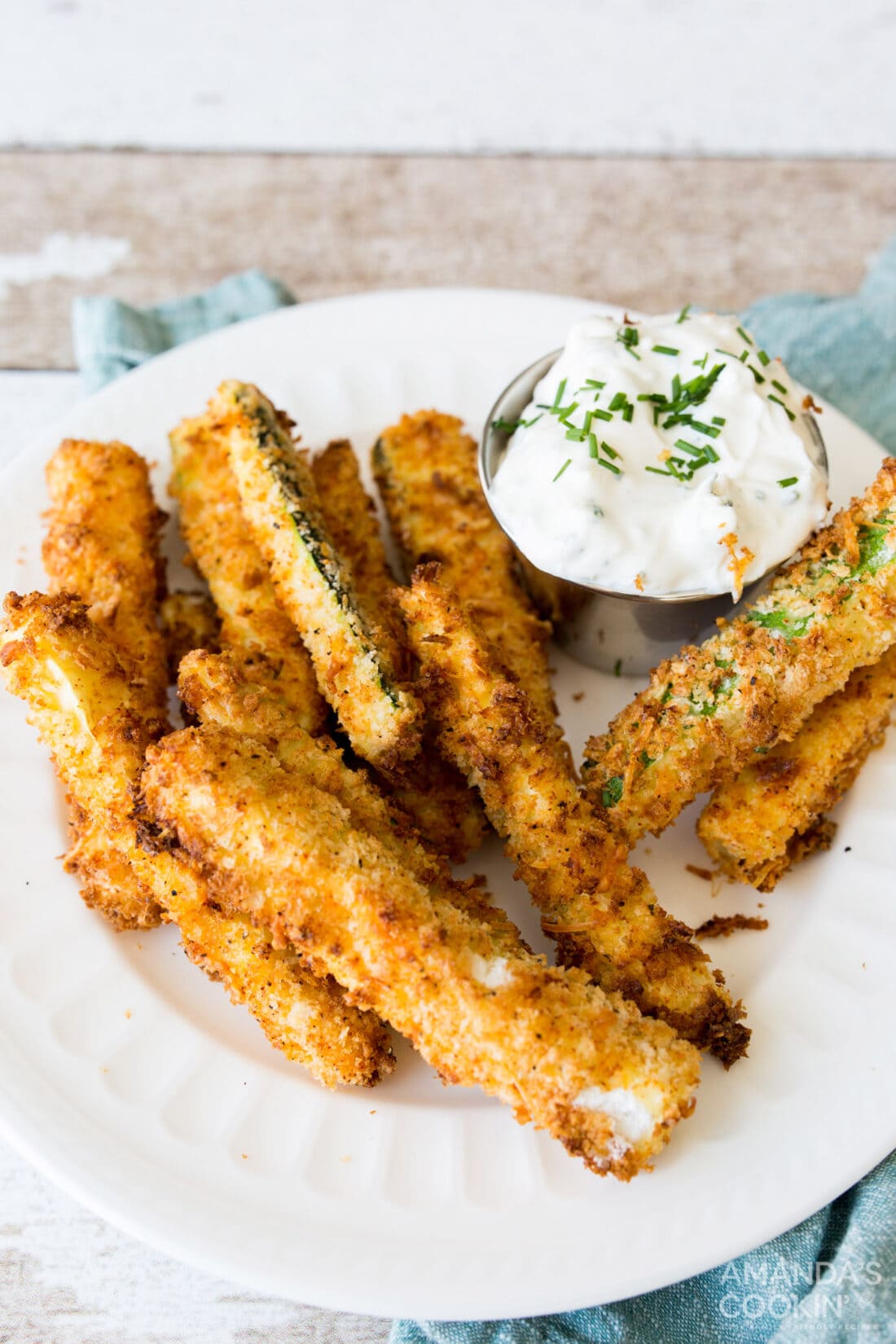 air fryer zucchini fries and sauce on a plate