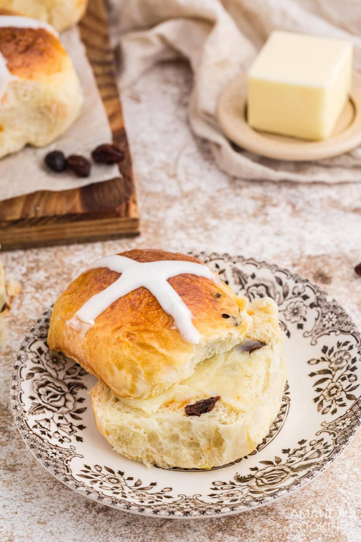 a sliced Hot Cross Bun on a plate