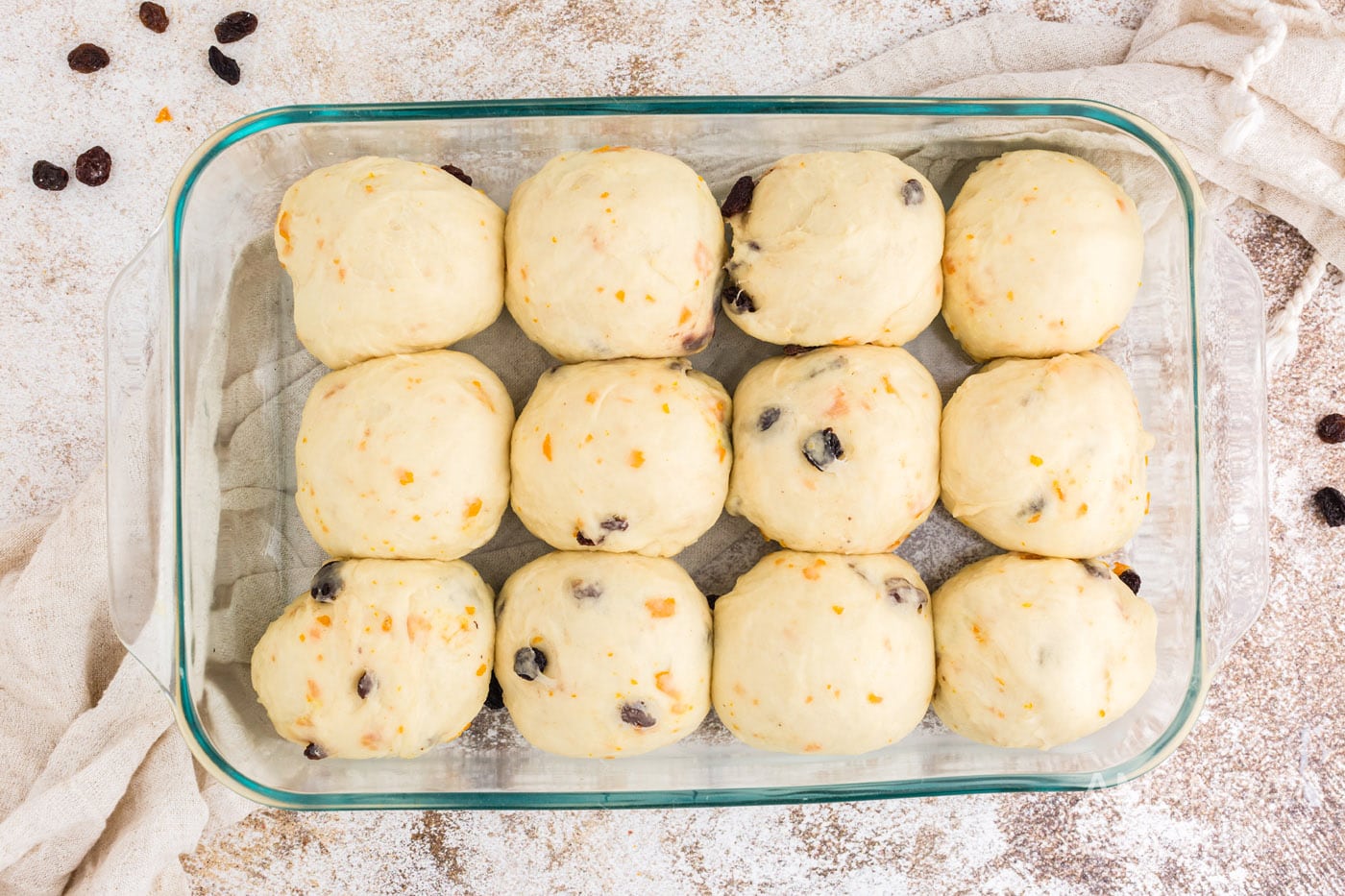 large dough balls in a baking dish