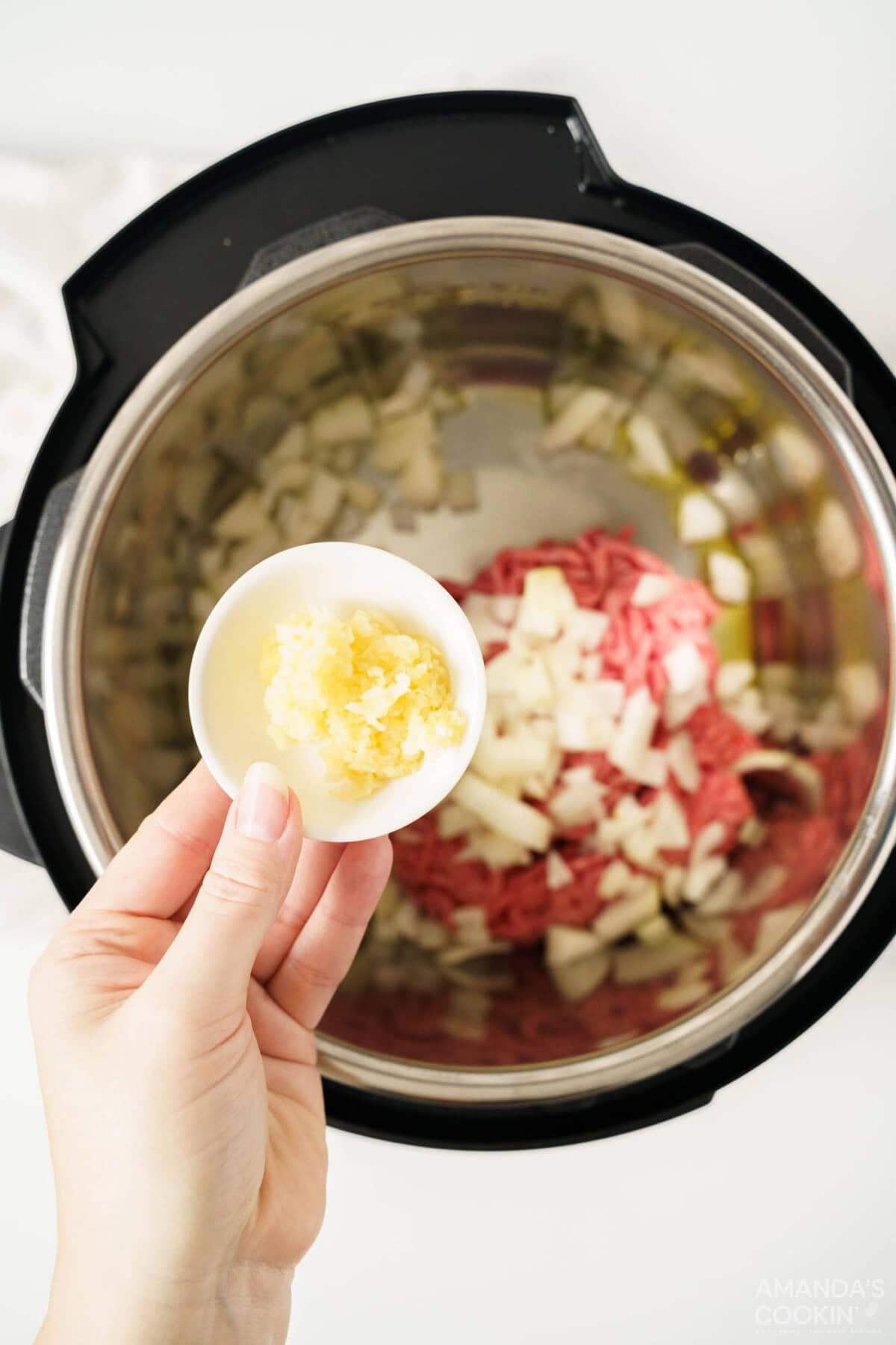sautee onion, beef, and garlic in instant pot