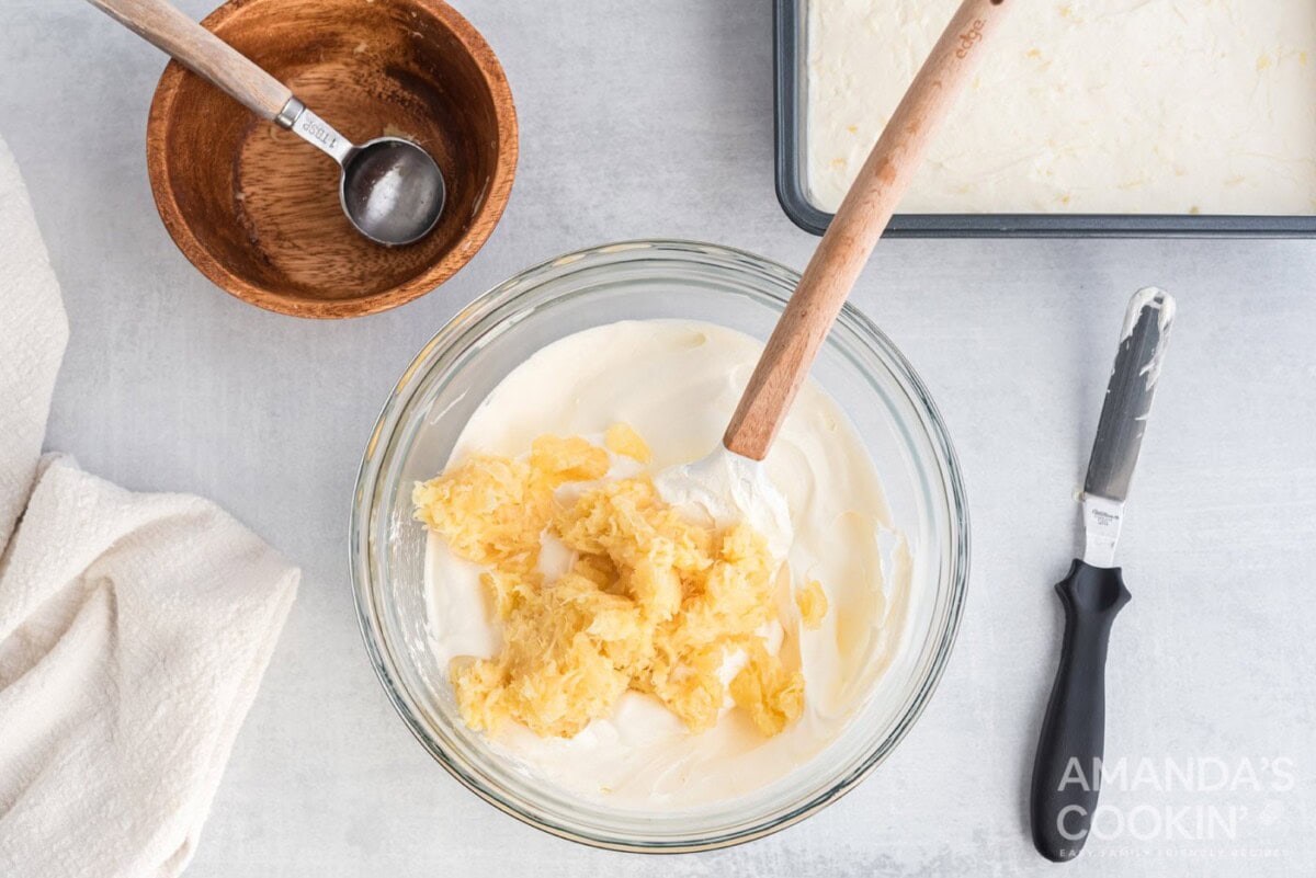 mixing pineapple with cool whip