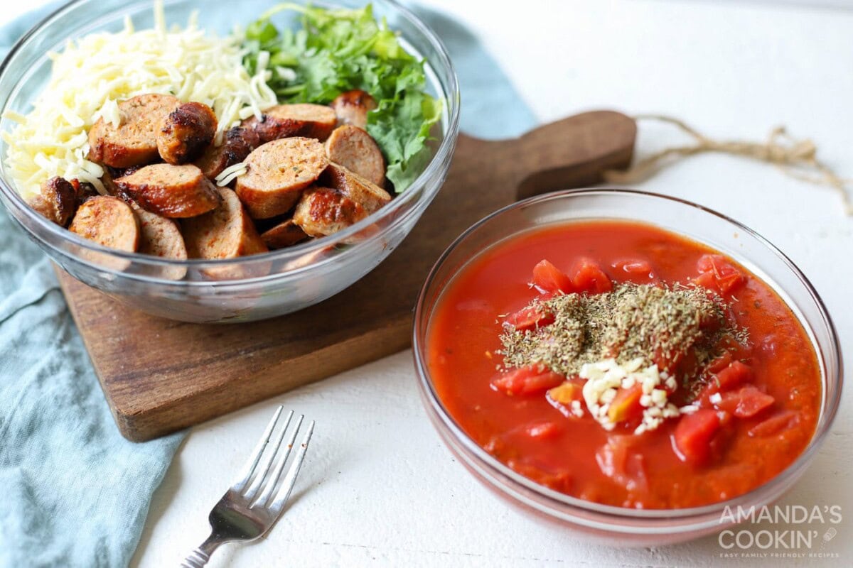 a bowl with sauce ingredients and one with sausage, cheese, and spinach.
