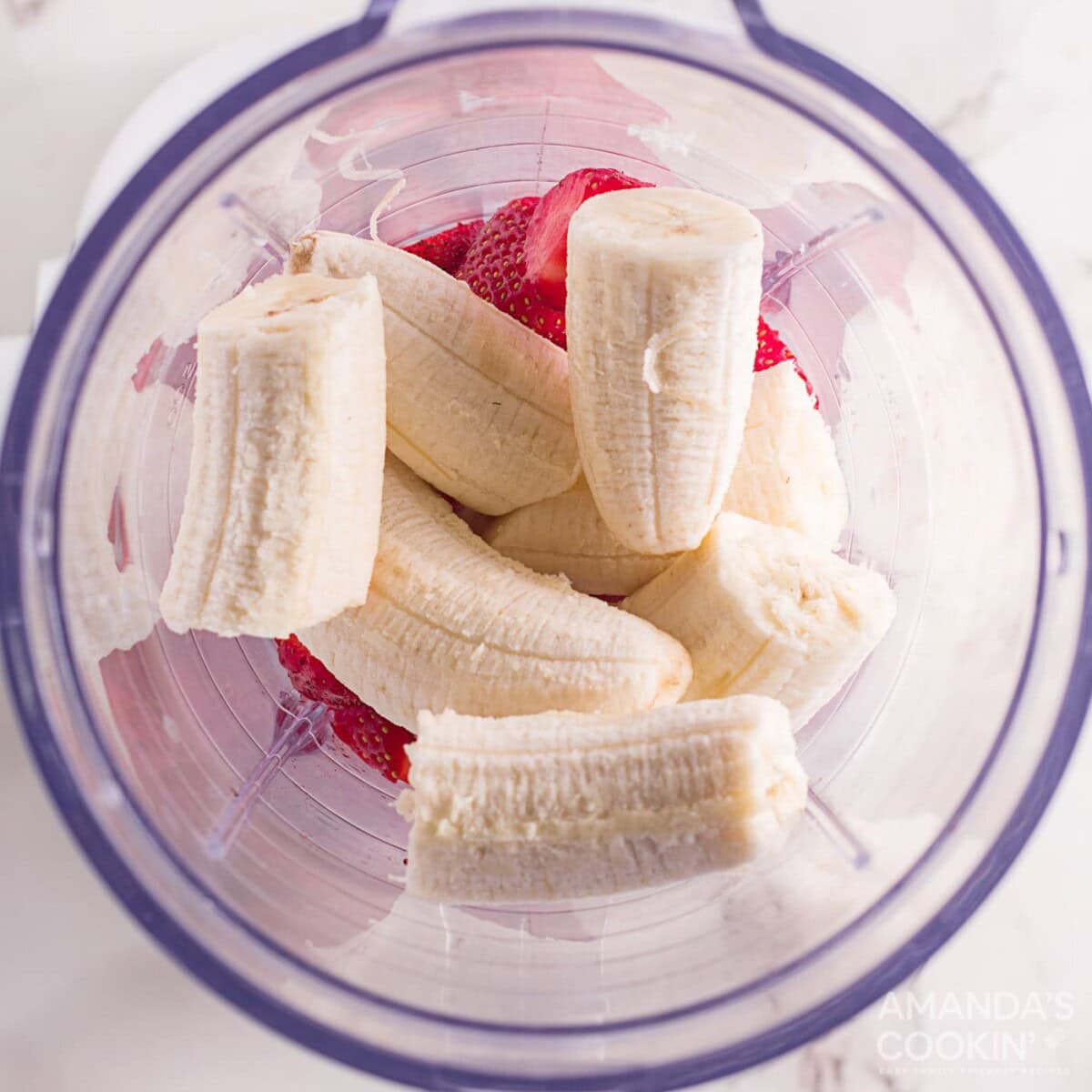 bananas in a blender with strawberries