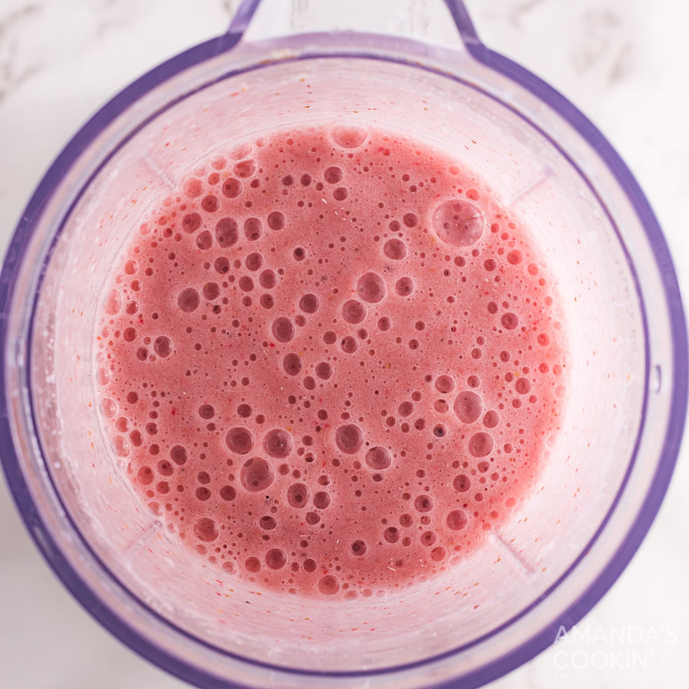 strawberry banana fizzy float mixture in a blender