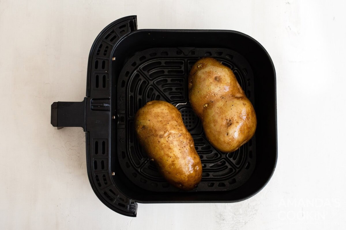 russet potatoes in an air fryer basket